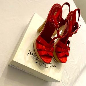 Red YSL “Tribute” strappy sandals.